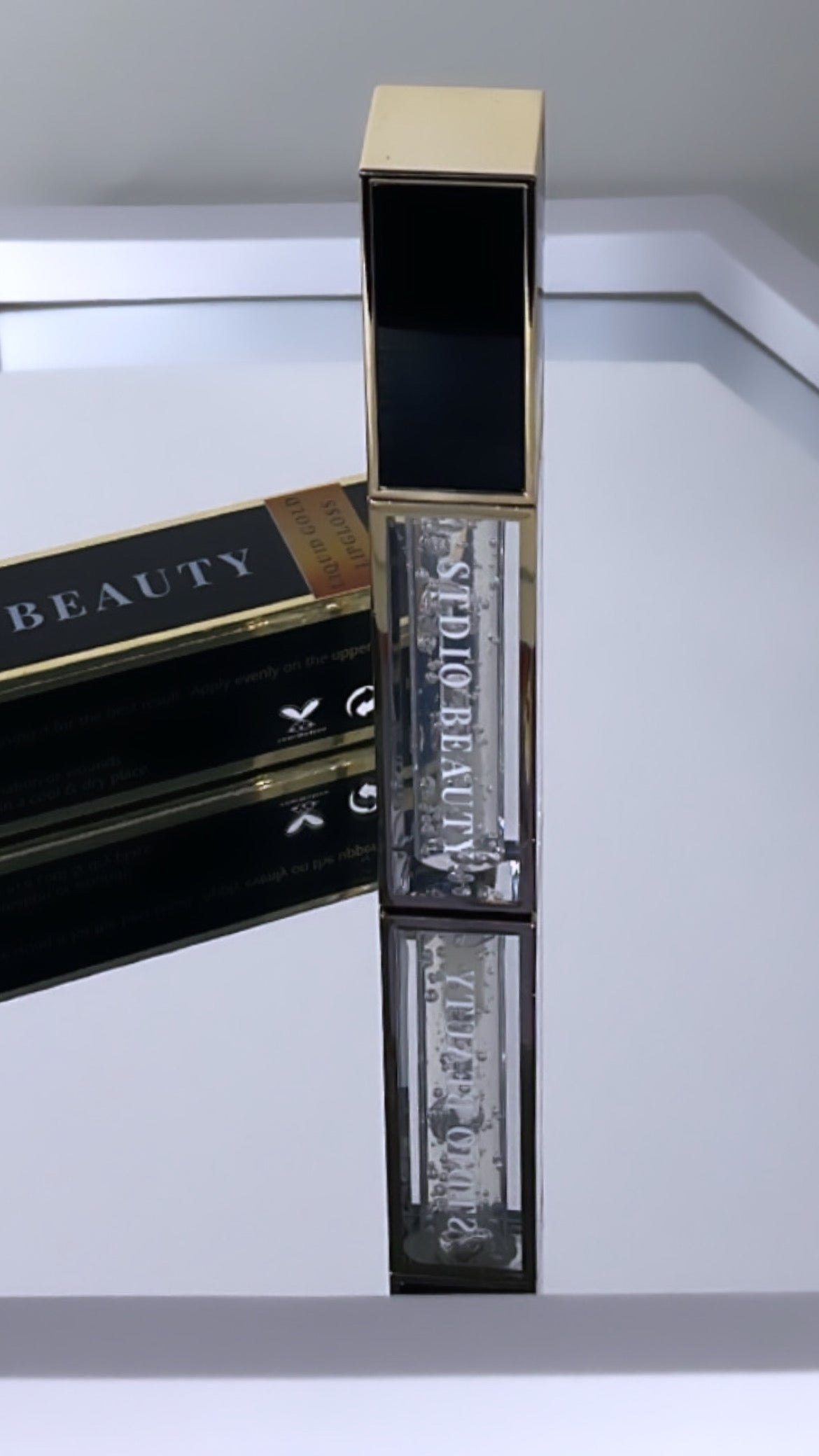 SOLO | LIQUID GOLD LIP GLOSS.