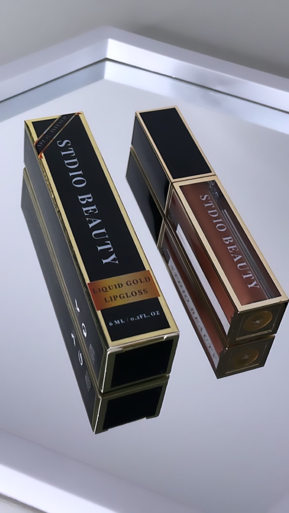 INTERLUDE | LIQUID GOLD LIP GLOSS.